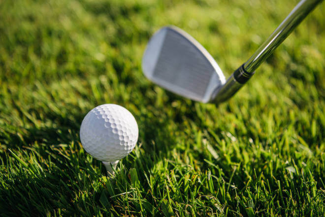 Golf club and ball closeup